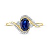 Thumbnail Image 2 of Oval-Cut Blue Lab-Created Sapphire & Diamond Bypass Ring 1/15 ct tw 10K Yellow Gold