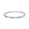Thumbnail Image 1 of Oval-Cut Swiss Blue Topaz & White Lab-Created Sapphire Link Bracelet Sterling Silver 7.25"