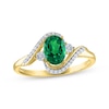 Thumbnail Image 1 of Oval-Cut Lab-Created Emerald & Diamond Bypass Ring 1/15 ct tw 10K Yellow Gold