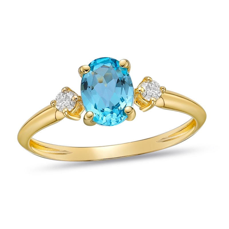 Swiss Blue Topaz & Diamond Ring 1/10 ct tw Oval/Round-Cut 10K Yellow Gold