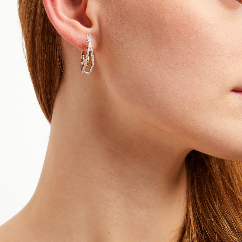 Main Image 4 of Unstoppable Love Diamond Crossover Double Hoop Earrings 1/4 ct tw 10K Two-Tone Gold