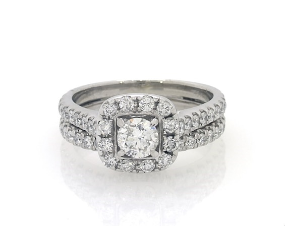 Previously Owned Neil Lane Round-Cut Diamond Halo Bridal Set 1-3/8 ct tw 14K White Gold Size 7